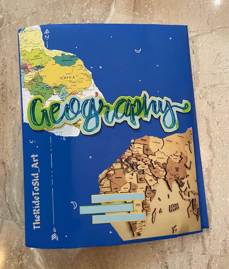 a blue book with the words geographs on it