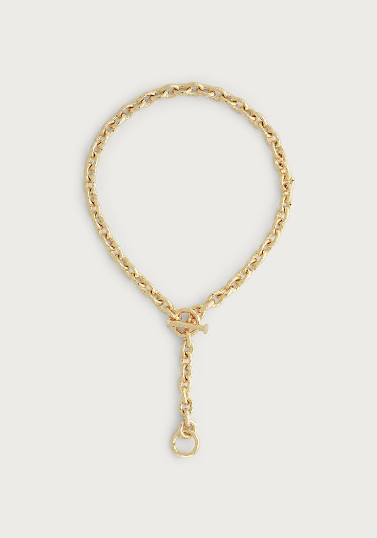 Indulge in the luxury of the Farrier Thick Chain Necklace. Crafted with 18k gold dipped brass and featuring a luxurious toggle clasp, this necklace exudes the sophistication and elegance of an heirloom piece, while providing a modern and versatile design that can be worn many ways. This collection was inspired by the age-old profession of farriers, who are craftsman that hammer and shape horse shoes. Here, we have styled the Farrier Chain Necklace with the pendant from our Bamboo Pendant Necklac Elegant Metal Toggle Necklace With Cable Chain, Luxury Jewelry With Toggle Clasp And Link Shape, Elegant Link Chain Necklace With Toggle Clasp, Luxury Link Jewelry With Toggle Clasp, Elegant Yellow Gold Chain Link Toggle Necklace, Chic Formal Jewelry With Toggle Clasp, Elegant Gold Toggle Necklace With Chain, Luxury Toggle Necklace With Chain For Formal Occasions, Luxury Chain Link Jewelry With Toggle Clasp