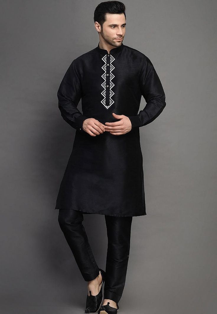 Art Silk Kurta in BlackThis Readymade attire is Enhanced with Buttons and Resham Work. Crafted in Chinese Collar Neck and Full SleeveAvailable with an Art Silk Pant in BlackDo note: Footwear shown in the image is for presentation purposes only. Half to one inch may vary in measurement. (Slight variation in actual color vs. image is possible) We sell all kinds of menswear. Mens Kurta | Mens Kurta Pajama | Mens Sherwani | Mens Sherwani Sets | Traditional Menswear | Partywear Menswear | Indian Mens Black Chanderi Sherwani With Traditional Drape, Black Chanderi Sherwani For Navratri, Black Chanderi Sherwani Straight Kurta, Traditional Black Chanderi Sherwani, Black Chanderi Sherwani With Chikankari Embroidery, Black Chikankari Chanderi Sherwani, Black Embroidered Fabric For Designer Wear During Eid, Festive Black Chanderi Sherwani, Ceremonial Churidar With Embroidered Border And Long Sleeves