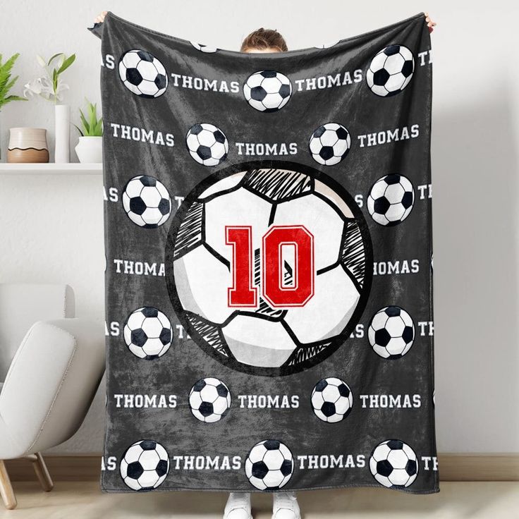 a soccer themed blanket with the number ten on it