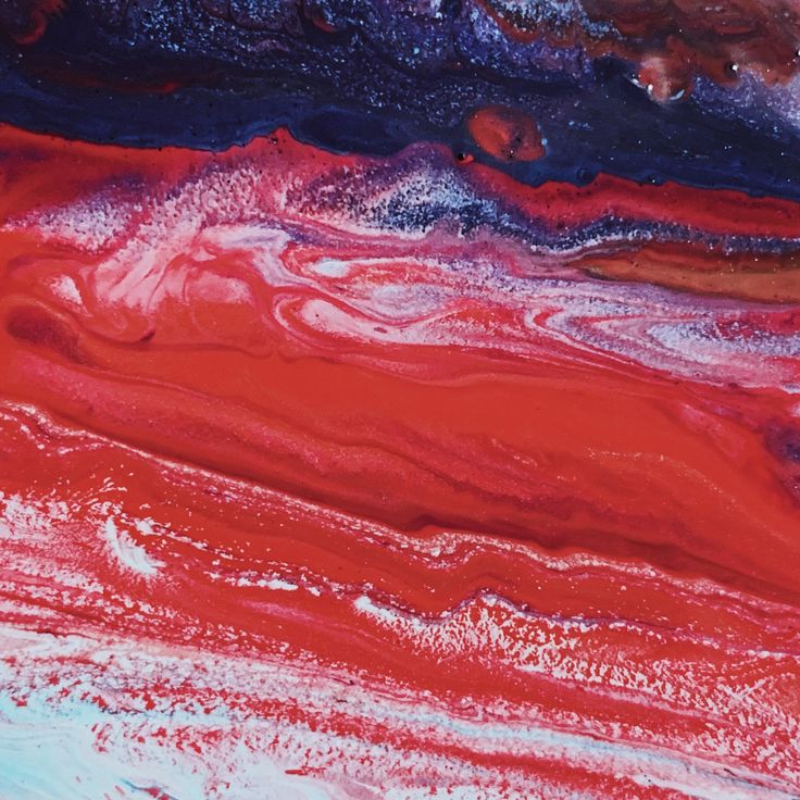 an abstract painting with red, blue and white colors on it's surface is shown