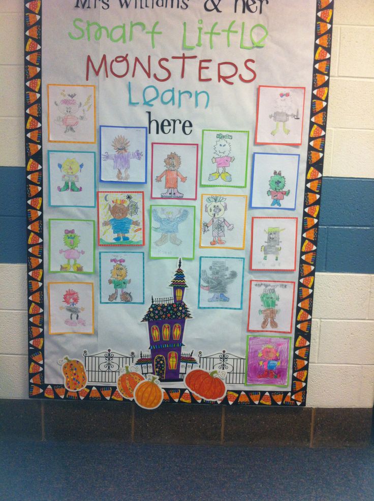 a bulletin board with pictures of monsters and pumpkins in front of the words smart, life, monsters, learn here