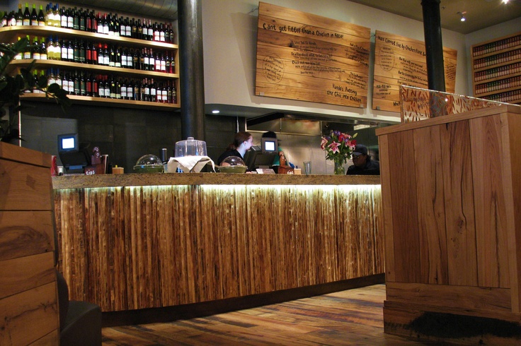 a counter in a restaurant with lots of bottles on it