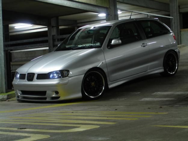 a silver car parked in a parking garage