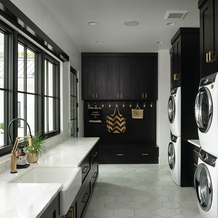 a washer and dryer in a large laundry room