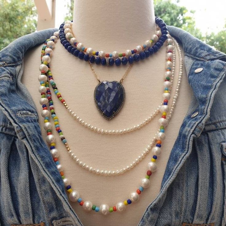 "Bright, vibrant beads make this necklace perfect addition to your summer sundress or a white blouse. African glass beads and 4mm white freshwater pearls are beaded to create a color block strand. You can wear this necklace single, double or even triple! Alone or layered with your favorites, this necklace exudes a playful, eclectic bohemian elegance. Necklace: 49\" plus extender Layer this necklace with: https://www.etsy.com/listing/637252353/baroque-pearl-and-turquoise-necklace?ref=shop_home_ac Bohemian White Crystal Necklaces With Round Beads, Round Bead Pearl Necklace For The Beach, White Single Strand Beaded Necklace For Festival, Beach Pearl Necklace With Round Beads, Bohemian Beaded Pearl Necklace For Vacation, Pearl Necklace With Round Beads For Beach, Summer Pearl Beaded Necklaces, Bohemian Blue Necklace With Pearl Chain, Pearl Beaded Necklaces For Summer