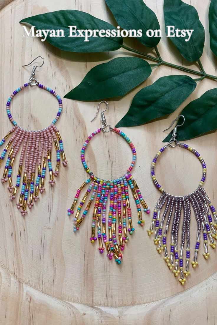 Check out Mayan Expressions on Etsy for more colors and designs. Traditional Beaded Dangle Hoop Earrings, Bohemian Heishi Beads Hoop Earrings As Gift, Handmade Heishi Beads Earrings For Festivals, Artisan Beaded Earrings For Festive Occasions, Bohemian Festive Beaded Tassel Earrings, Bohemian Hoop Earrings With Dangling Beads For Festive Occasions, Unique Festive Beaded Drop Earrings, Festive Unique Beaded Drop Earrings, Festive Colorful Beaded Earrings