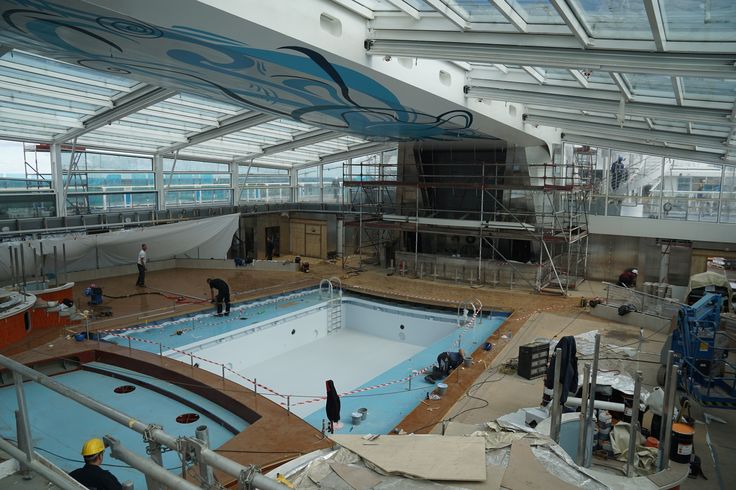 an indoor swimming pool being built in a building