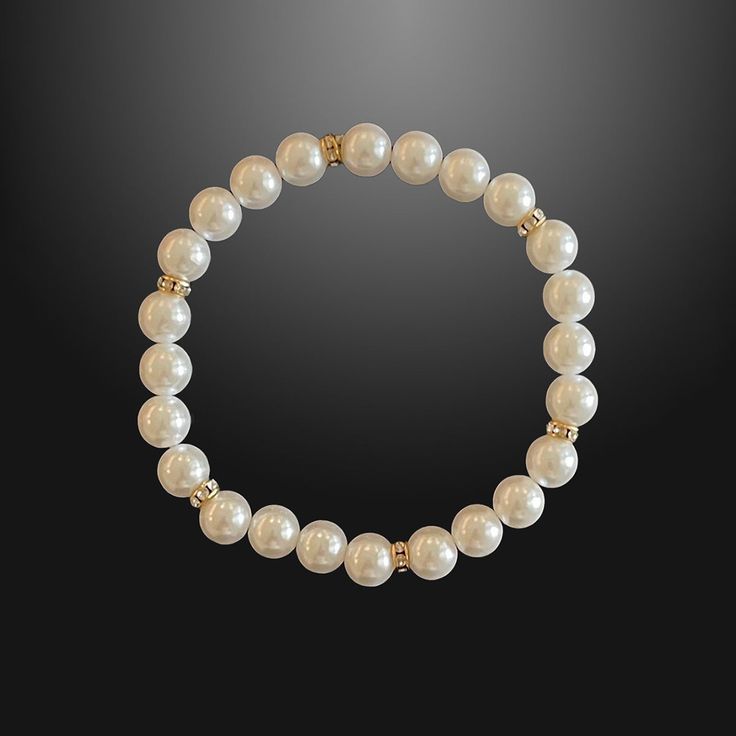 In a world saturated with mediocrity, nothing can rival the authenticity of traditional luxury. This subtly opulent bracelet showcases genuine white freshwater pearls, elegantly interspersed with lab diamond studded rondelles in gold. Hand-strung with care in our Orlando studio, this stretch bracelet adjusts over the wrist for easy transitions and offers versatile styling options with a comfortable wear. Our Men's Pearls Collection, features sophisticated fresh water pearl necklaces and bracelet Elegant Luxury Hand-strung Pearl Bracelet, Luxury White Beaded Bracelets With Pearl Chain, Classic Beaded Stretch Bracelet, Elegant White Beaded Stretch Bracelet, Elegant Gold Beaded Bracelets For Everyday Wear, Elegant Everyday Bracelets With Gold Beads, White Pearl Embellished Bracelet, Elegant Bracelets With Gold Round Beads, Elegant Stretch Bracelet With Gold Beads