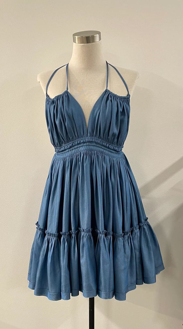 This cute dress ties on the shoulders and at the back for a sexy style. Makes it the perfect date night or special occasion dress. - Halter dress with double straps in 100% Tencel. - Adjustable in the back- Flowy- Ruffles- Ties at nape and lower back- Open back- Tiered tent skirt- High waist Tencel Denim, The Perfect Date, Perfect Date Night, Special Occasion Dress, Perfect Date, Tie Dress, Tiered Skirt, Cute Dress, Denim Fabric