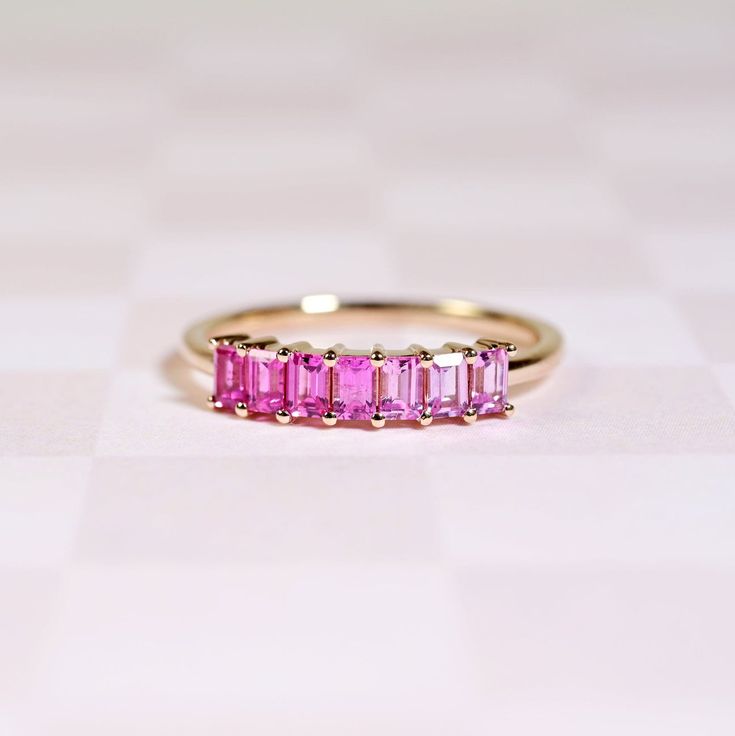 Emerald-Cut Pink Sapphire Demi Band Pink Emerald Cut Ruby Ring In Fine Jewelry, Emerald Cut Pink Ruby Ring In Fine Jewelry Style, Fine Jewelry Pink Sapphire Ring With Emerald Cut, Fine Jewelry Pink Emerald-cut Sapphire Ring, Pink Sapphire Stackable Ring In Fine Jewelry Style, Pink Emerald Cut Sapphire Ring In Fine Jewelry Style, Pink Emerald Cut Sapphire Ring Fine Jewelry, Fine Jewelry Emerald Cut Pink Sapphire Ring, Emerald Cut Pink Sapphire Ring In Fine Jewelry Style