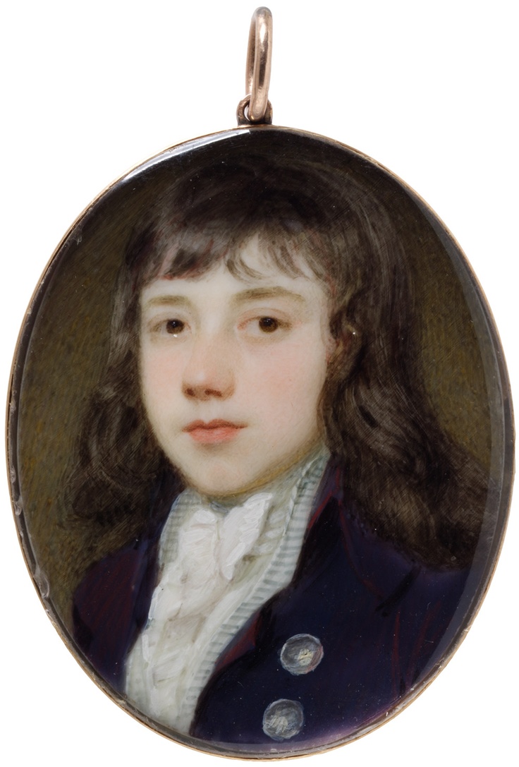 a portrait of a young boy wearing a blue jacket