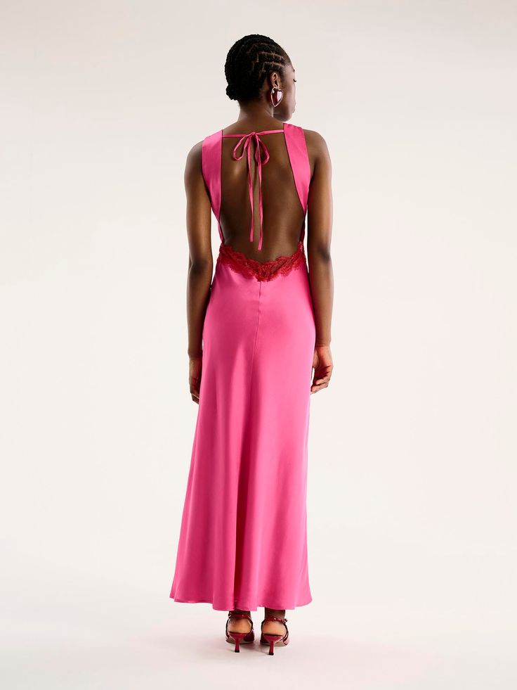 Aurelia features a plunging neckline and open back, artfully outlined by sustainable lace. Crafted from recycled polyester with a contrasting lace, she's oozing with feminine details from the curved tie-back to the peek-a-boo lace under the bust. Pink Lace Trim Slip Dress For Evening, Pink Lace V-neck Maxi Dress, Feminine Pink V-neck Lace Dress, Pink Lace Trim Mini Slip Dress, Pink V-neck Maxi Dress With Lace Trim, Cerise Pink, Velvet Collection, Swimwear Shorts, Plunging Neckline