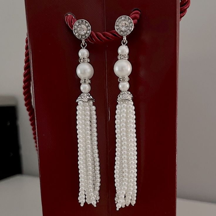 These Are Elegant Faux Pearl Earrings Beautifully Embellished With Rhinestones. They Measure 4” Long And Have Some Weight To Them. They Can Be Worn With Formal Attire Or Can Elevate A Casual Outfit. They Are Brand New. Elegant Silver Tassel Earrings With Dangling Beads, Elegant Silver Tassel Earrings With Rhinestone Fringe, Elegant Silver Tassel Earrings With Rhinestones, Elegant Pearl Drop Tassel Earrings For Party, Elegant Silver Beaded Tassel Earrings, Silver Tassel Wedding Earrings, Wedding Tassel Drop Earrings With Rhinestones, Silver Tassel Earrings With Rhinestones For Wedding, Silver Rhinestone Tassel Earrings For Wedding