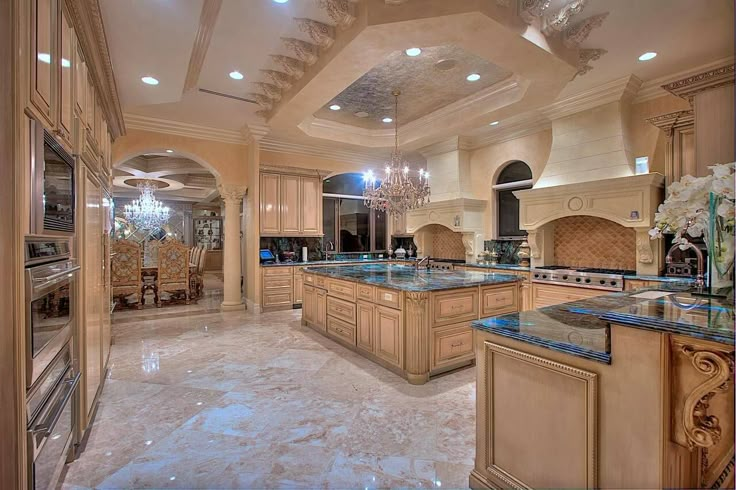 a large kitchen with an island and chandelier