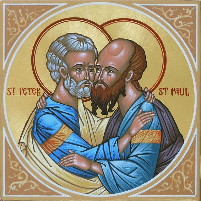 two men embracing each other with the words st peter and st paul on it's side