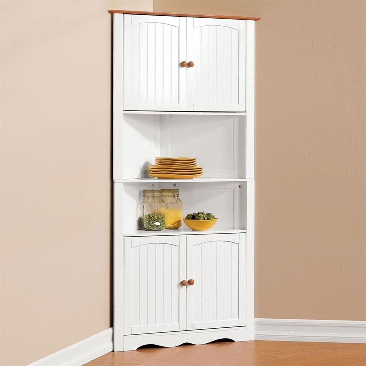 a white bookcase filled with lots of food