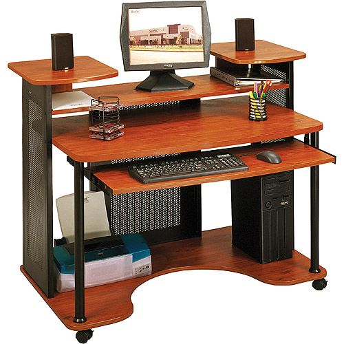 a computer desk with a monitor, keyboard and mouse on it's top shelf