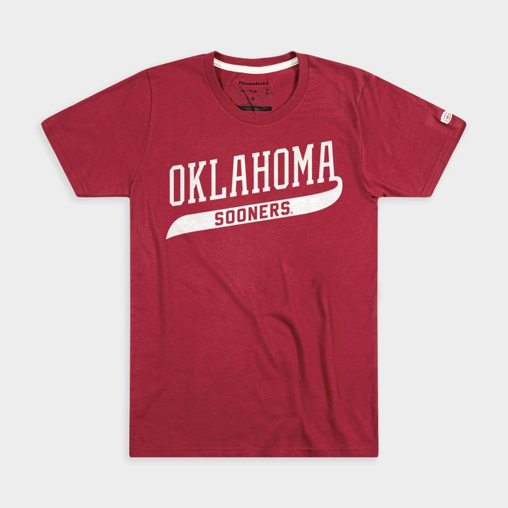 While this doubles as a classic, ‘90s-era Sooners design, Oklahoma diehards recognize this wordmark from their baseball uniforms in 1994. That year, of course, the Sooners won their second national championship as the No. 4 seed in the College World Series. Oklahoma survived the gauntlet, eventually defeating Georgia Tech for the title. Products are mocked up on a size S. Graphics may appear smaller on larger sizes. University Red Collegiate T-shirt For Fans, Collegiate Logo Print Tops For College, Collegiate T-shirt With University Logo For Game Day, University Red Collegiate T-shirt With Letter Print, Collegiate Tops With University Logo, Casual Tops With University Logo For Fan Gear, Collegiate Tops With University Logo For Game Day, Varsity Tops With University Logo For College, Collegiate T-shirt With Lettering For College