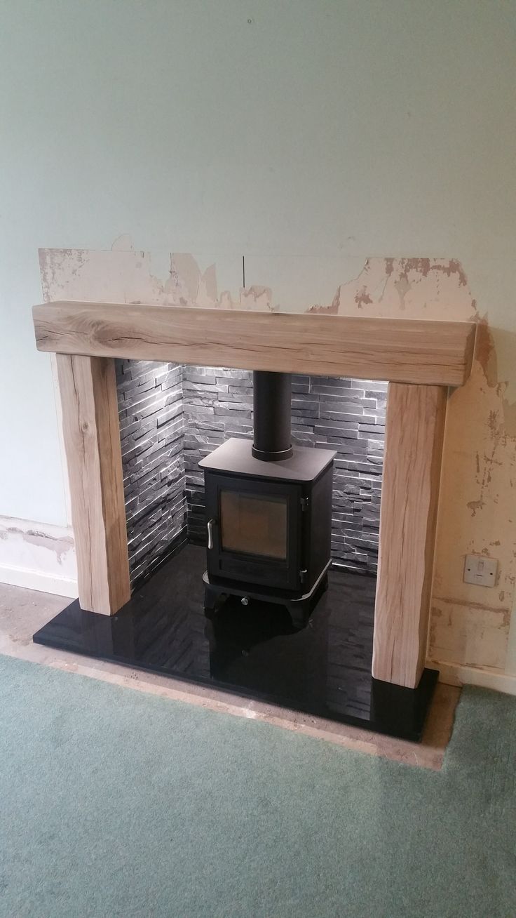 a wood burning stove sitting inside of a room