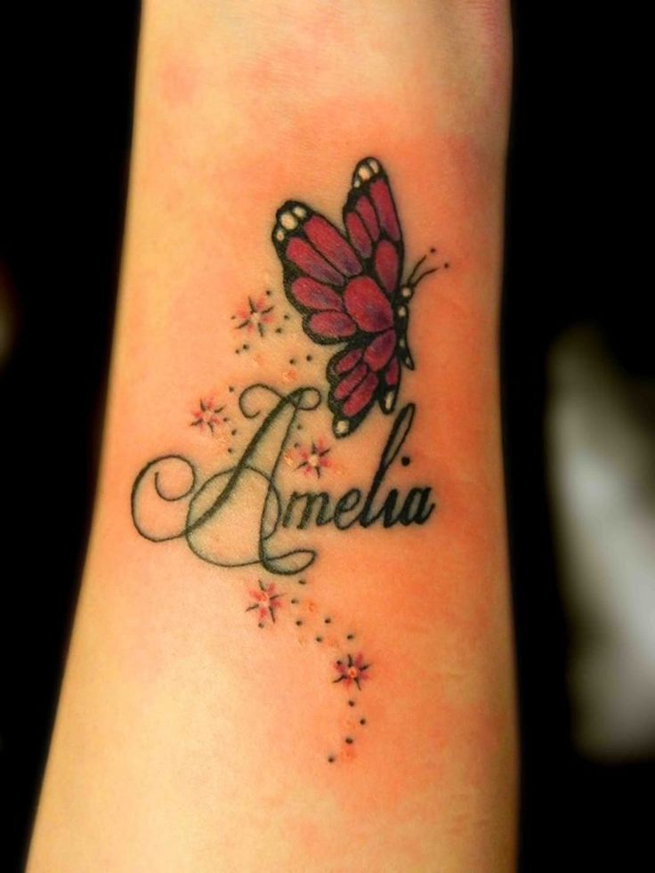 a small butterfly tattoo with the word amelo on it's side ankle area