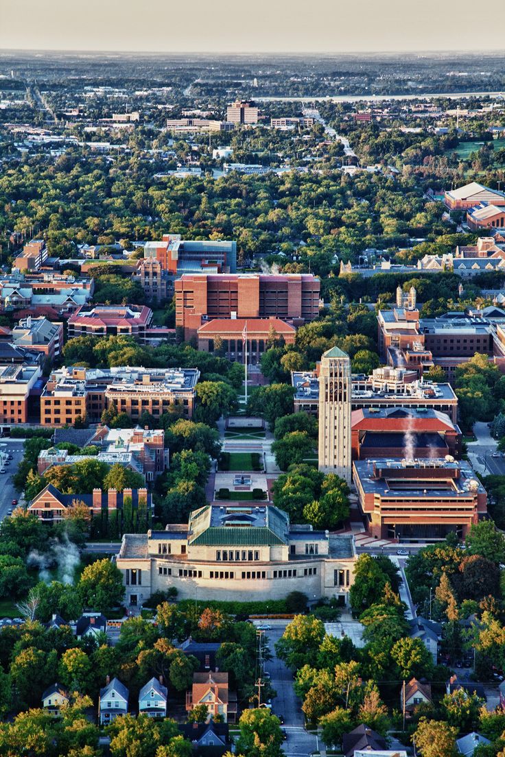 an aerial view of a city with trees and buildings