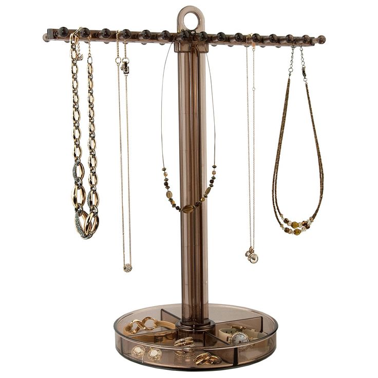 a jewelry stand with several necklaces hanging from it