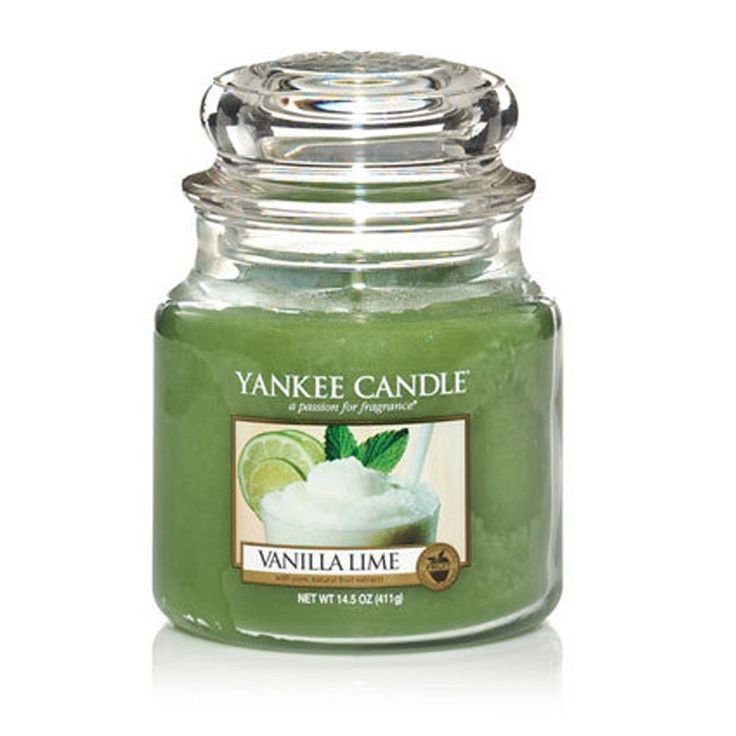 yankee candle with lime and whipped cream in the front, on a white background photo