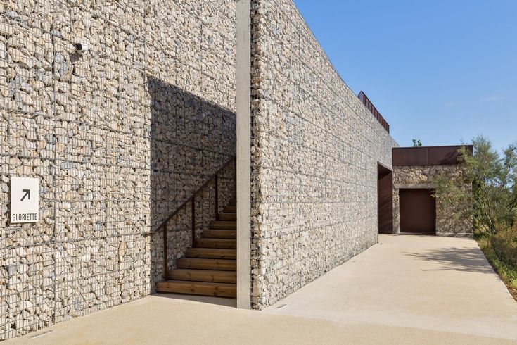 a stone building with stairs leading up to it