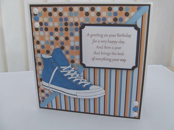 a handmade birthday card with a blue sneaker on the front and an orange stripe background