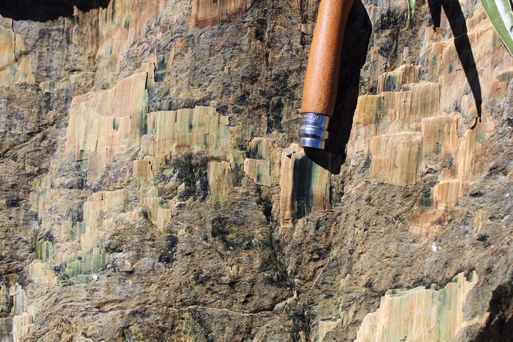 a knife stuck in the side of a mountain