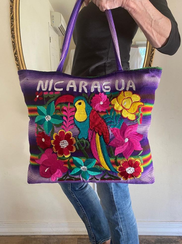 "Large embroidered tote, purse, shoulder bag, Embroidered flowers, Colorful Bird Lined with Zip closure Great condition. Says Nicaragua on it. 14\" tall 16\" width 3 1/2\" thick 9 1/2\" strap drop Excellent condition NK189DR Large embroidered tote, purse, shoulder bag, Embroidered flowers, Colorful Bird" Floral Embroidered Shoulder Bag For Travel, Multicolor Embroidered Tote Bag, Embroidered Multicolor Satchel Tote, Multicolor Embroidered Satchel Shoulder Bag, Multicolor Embroidered Shoulder Satchel, Multicolor Floral Embroidered Tote Shoulder Bag, Embroidered Multicolor Travel Bag, Travel Shoulder Bag With Multicolor Floral Embroidery, Multicolor Floral Embroidery Tote Shoulder Bag