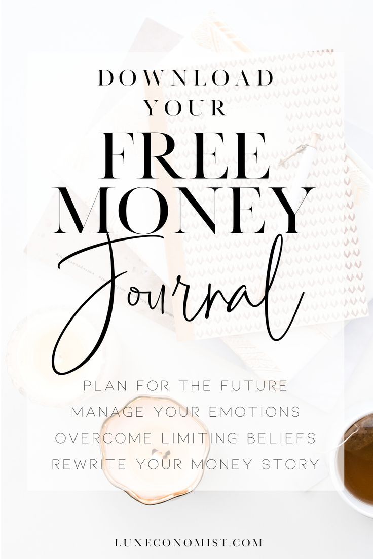 the free money journal with coffee and other items on it, including an open book