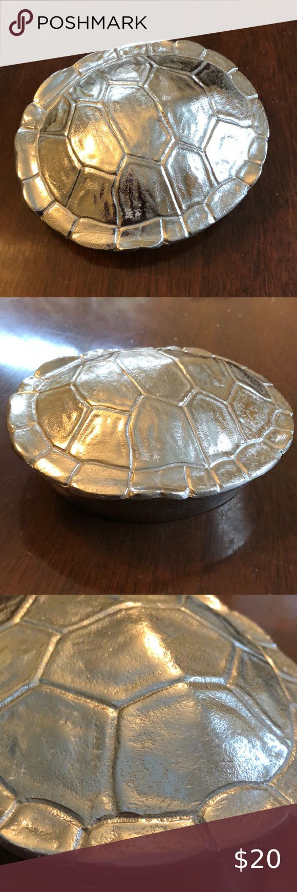 two metal plates sitting on top of a wooden table