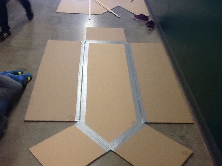 several pieces of cardboard laid out on the floor