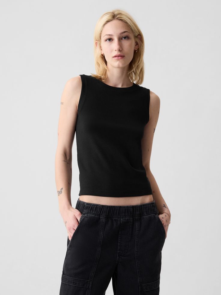 Slightly cropped soft knit tank top.  Crewneck.  Sleeveless.  Straight silhouette with a slim, slightly cropped fit.  Size up for a looser, longer fit.  Hits at the waist.  Models wearing Gap