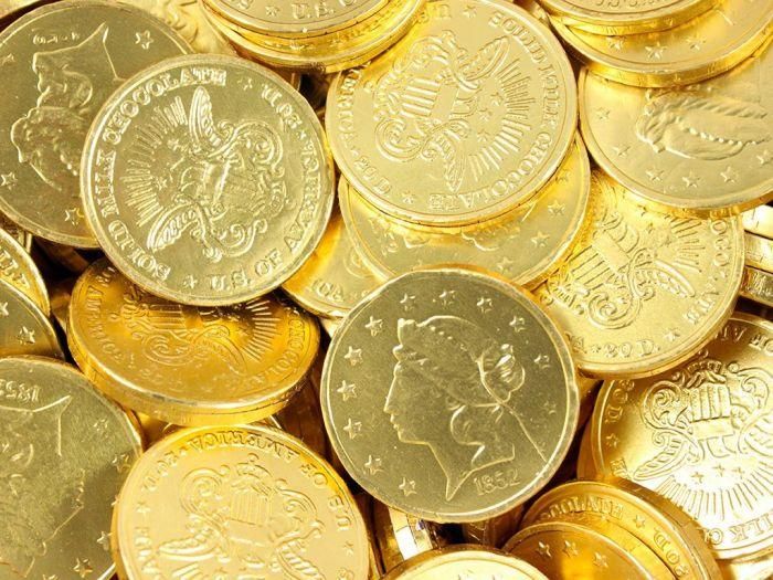 a pile of gold coins sitting on top of each other