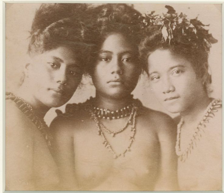 three women with necklaces on their heads