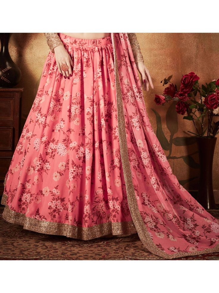 <ul>
<li style="text-align: justify;"><span style="text-align: justify;">Look super gorgeous in this pink flared pink colored organza silk bridal sabyasachi designer girlish lehenga beautified with floral digital print all over.</span></li>
<li style="text-align: justify;"><span style="text-align: justify;">Along with a heavily embroidered golden color choli with silk lining and pink matching organza dupatta with lace details in similar printed design.&l Pink Salwar Kameez With Cutdana For Navratri, Navratri Pink Salwar Kameez With Cutdana, Navratri Pink Cutdana Salwar Kameez, Pink Georgette Sets With Cutdana, Pink Semi-stitched Anarkali Set For Festivals, Pink Lehenga With Cutdana For Eid, Pink Cutdana Lehenga For Eid, Navratri Pink Set With Sheer Dupatta, Pink Sharara For Reception Navratri