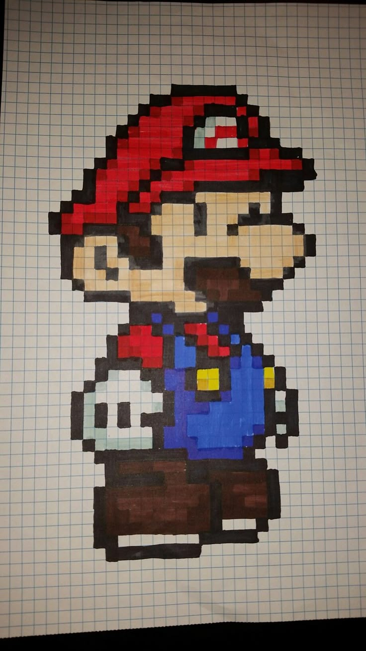 an image of a drawing of mario from the video game super mario bros on graph paper