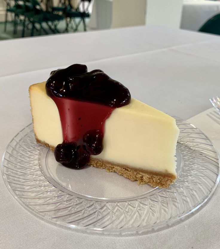 a piece of cheesecake on a clear plate