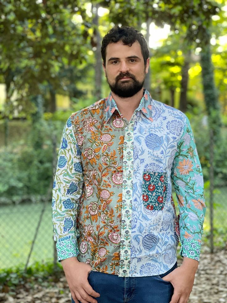 This funky patchwork 100% cotton shirt is handmade and block printed. It features long sleeves and a pocket in an upper left side. It closes by buttons. This shirt is free from the dictates of mass production being handmade by skilled woodblock artisans using exclusively local high quality cotton. It is somehow exotic, funky and fun but at the same time stylish in an own particular way. SIZE Shoulders 50 cm Chest 116 cm Sleeve 61 cm Length 75 cm This item is handmade so it may present minor irre Relaxed Fit Cotton Shirt With Multicolor Print, Relaxed Fit Multicolor Print Cotton Shirt, Relaxed Fit Multicolor Cotton Shirt, Long Sleeve Multicolor Print Top With Patchwork, Long Sleeve Multicolor Print Patchwork Top, Multicolor Print Long Sleeve Patchwork Top, Long Sleeve Multicolor Patchwork Top, Multicolor Floral Patchwork Long Sleeve Top, Multicolor Long Sleeve Top With Floral Patchwork