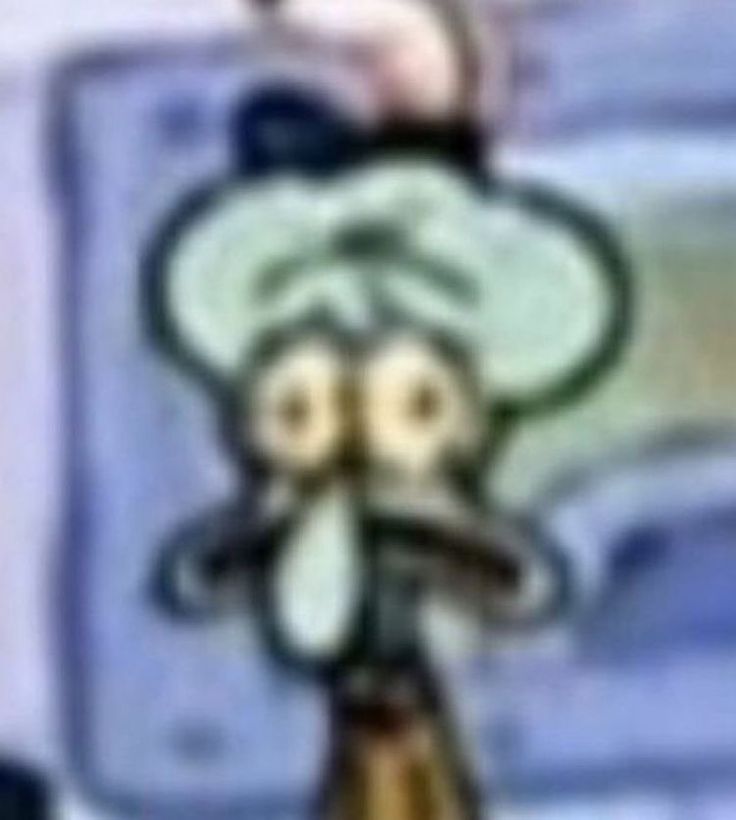 a blurry image of a cartoon character with a hat on top of his head