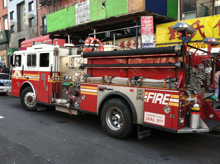 a fire truck is parked on the side of the street