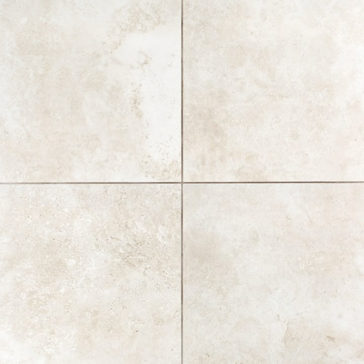 a white tile floor with four squares in the middle and one square at the top