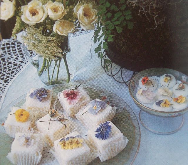 several desserts are on a plate with flowers in the background