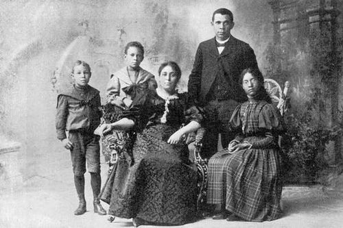 an old black and white photo of a family