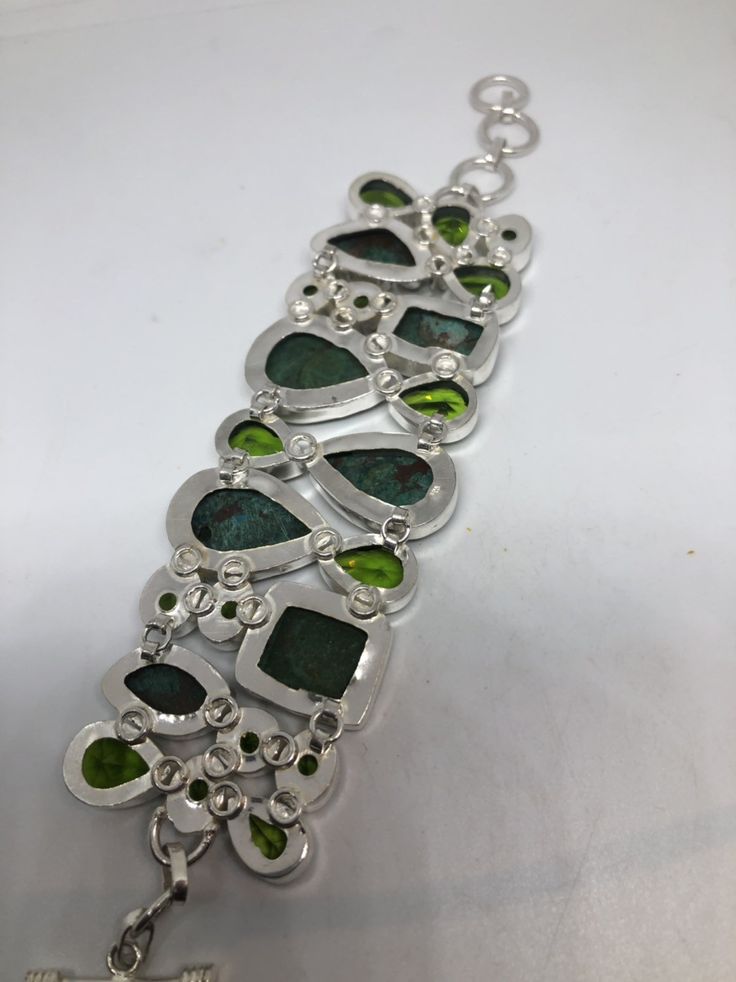 Vintage green gemstone bracelet Hand set in low content silver NOT 925 Bloodstone, Chrysoprase and antique peridot glass About 2 in wide Adjusts 6-8 in All jewelry is shipped in a nice gift box. Check out our over a THOUSAND great reviews Engraving is $4 per letter and is not always perfect depending on the piece. It can take a few days if the jeweler is busy. This is payable to Paypal Judithsltd@gmail.com Collectible Silver Bracelets With Natural Stones, Green Metal Bangle Jewelry, Green Cabochon Bracelet For Formal Occasions, Green Sterling Silver Collectible Jewelry, Green Cabochon Bracelets For Formal Occasions, Green Stone Bracelets As A Gift, Collectible Green Sterling Silver Jewelry, Elegant Green Cabochon Bracelets, Green Formal Bracelet Jewelry