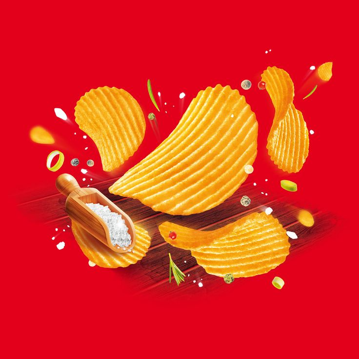 an image of potato chips falling into the air with ketchup and mustard on them