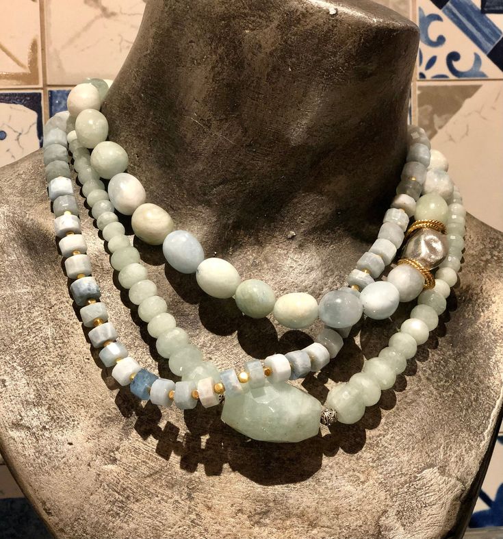 "This is a stunning trio of statement necklaces. Pale green jade gemstones necklace, worn together with egg shaped milky aquamarine stones and sliced milky aquamarine stones. All these create a stunning combination and a bohemian look. This necklaces can be worn together or separately and will work for everyday or with an evening dress. Each necklace can be purchased separately for $240 usd. Dimensions: length - 17\" - 19\" (including clasp) extender- can be added by request *If, for any reason, Handmade Elegant Amazonite Necklace, Turquoise Aquamarine Gemstone Beads Necklace, Unique Amazonite Jewelry With Round Beads, Turquoise Aquamarine Beaded Necklace, Elegant Amazonite Round Beads Jewelry, Elegant Round Bead Amazonite Jewelry, Elegant Round Beaded Amazonite Jewelry, Aquamarine Gemstone Round Bead Necklaces, Turquoise Chalcedony Necklace With Natural Stones